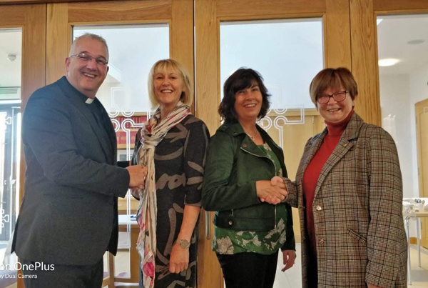 The Rev Malcolm Ferry with Eileen and Noelle on their appointment in 2019, and Agherton Parish pastoral care coordinator Wendy Floyd.